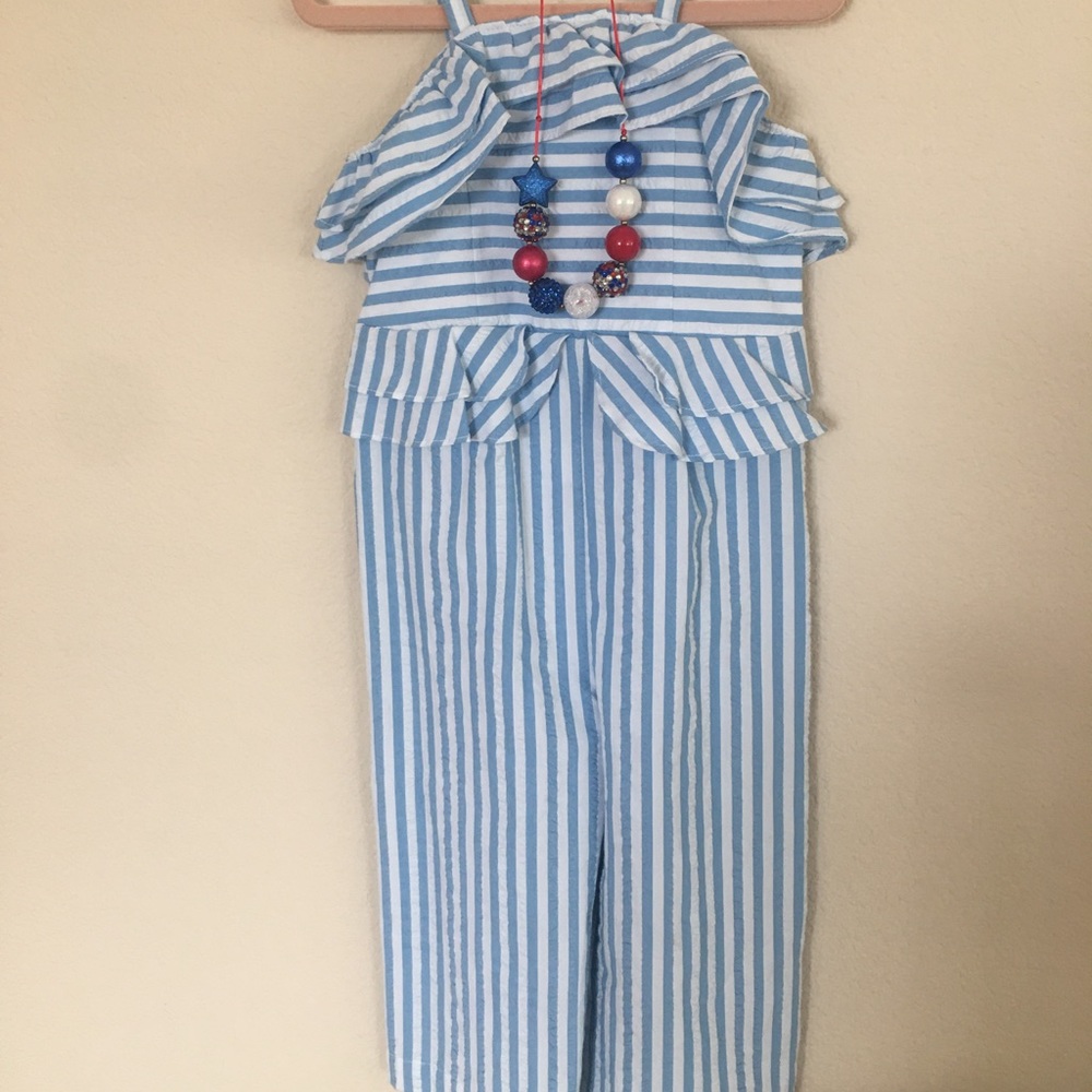 Jumper and necklace.